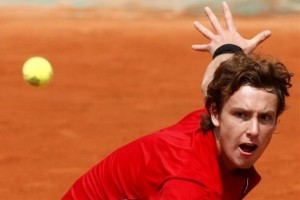 Latvia's Ernest Gulbis returns the ball to France's Michael Llodra during their fourth round match of the French Open tennis tournament, Sunday June 1, 2008 at the Roland Garros stadium in Paris. (AP Photo/Laurent Baheux)