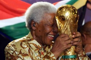 South African former President Nelson Mandela holds the Jules Rimet World cup, 15 May 2004 at the FIFA headquarters in Zurich. South Africa won the right to host the 2010 World Cup finals, the first to be played in Africa, football's world governing body FIFA announced here 14 May, "The 2010 World Cup will be organised by South Africa," said FIFA President Sepp Blatter. AFP PHOTO FRANCK FIFE