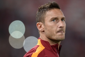 Roma's forward Francesco Totti looks on before the Champions League group stage football match AS Roma vs Bayern Munich on October 21, 2014 at the Olymic stadium in Rome.      AFP PHOTO / FILIPPO MONTEFORTE        (Photo credit should read FILIPPO MONTEFORTE/AFP/Getty Images)
